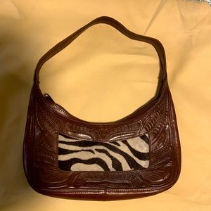 Hand tooled vintage leather bag with zebra fur detail